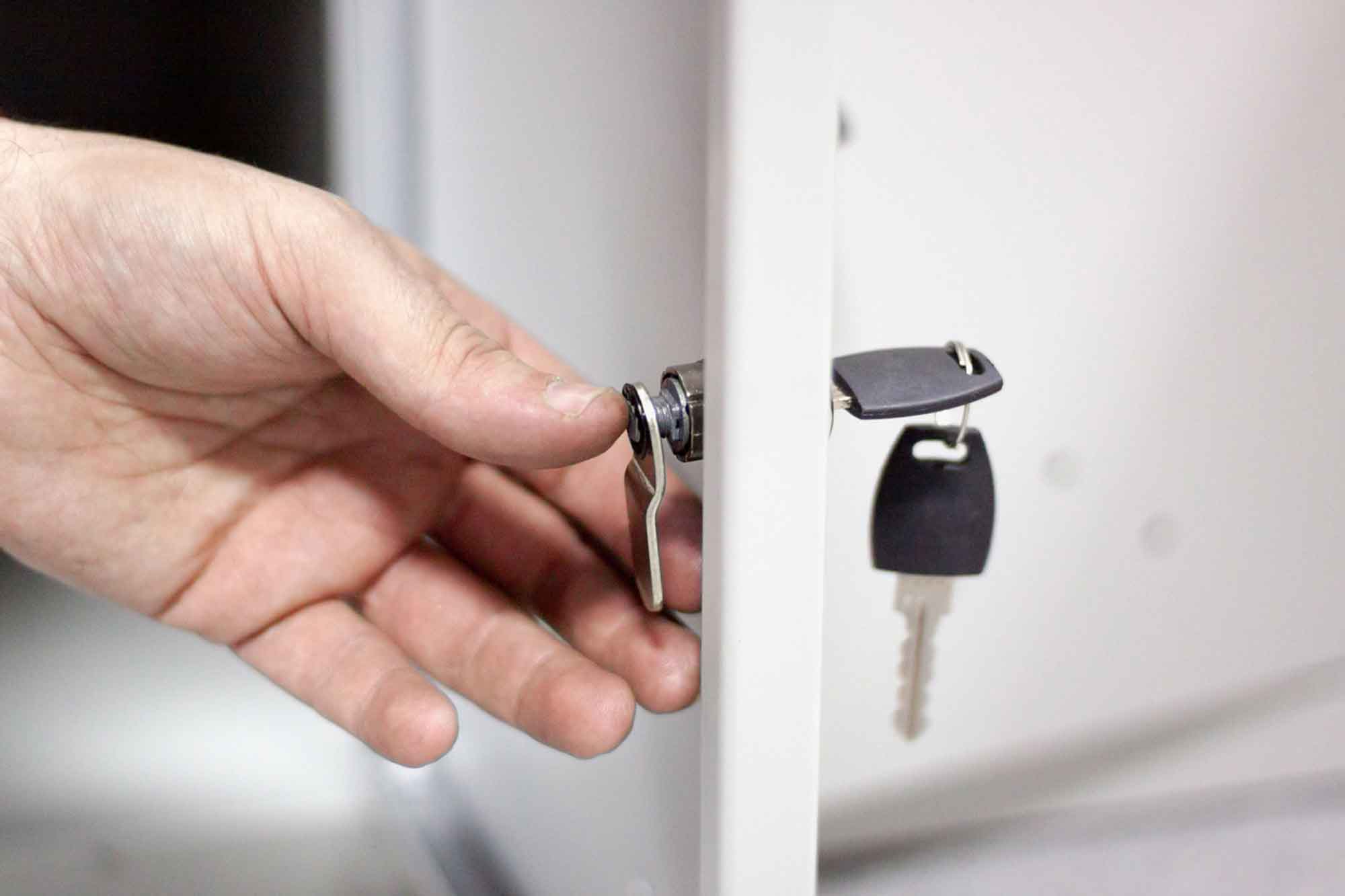 A cam lock being installed